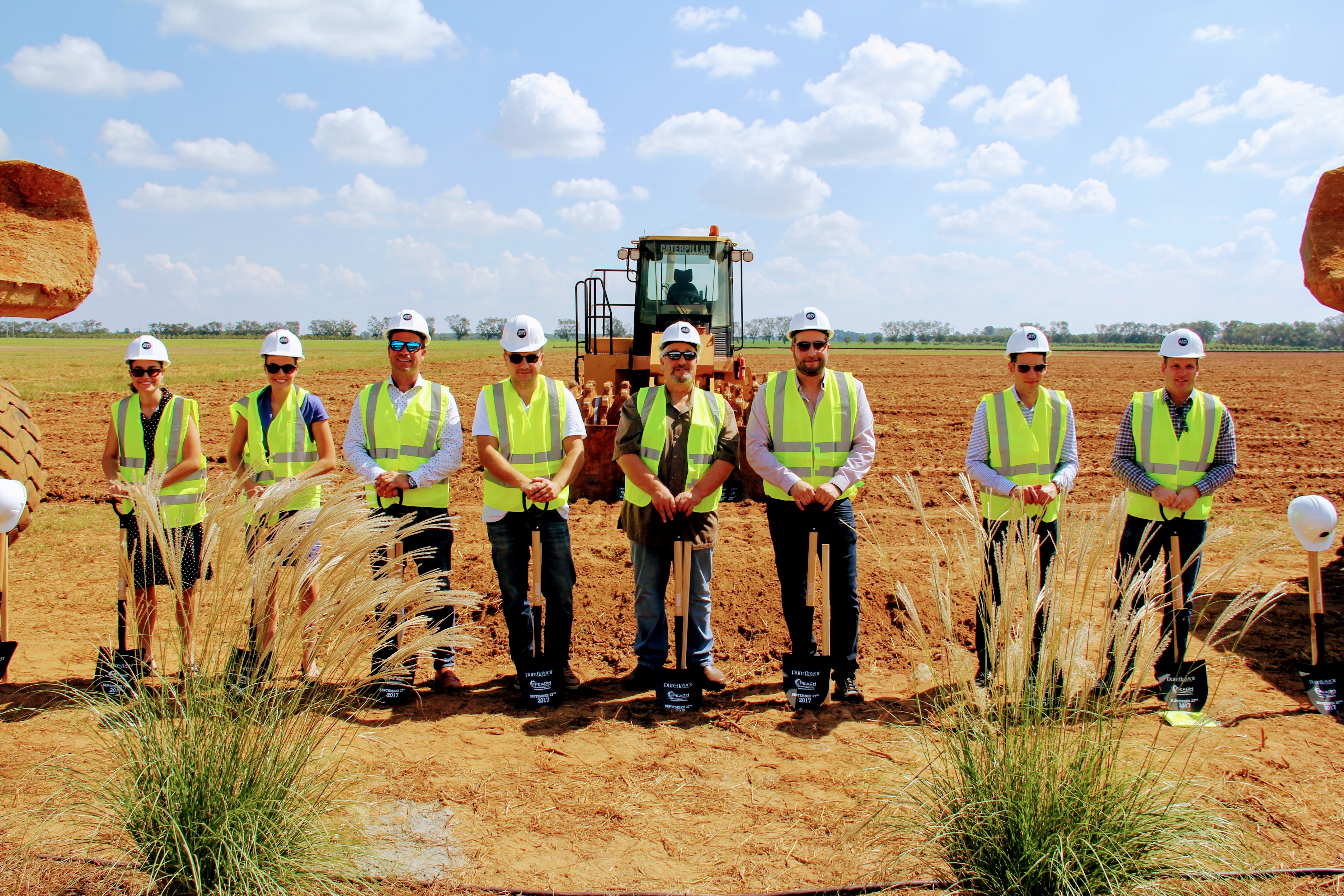 On a beautiful, sunny day, the team that brought Pure Flavor to life in Peach County, Georgia prepares to break ground at the site of what will be a massive greenhouse.  Pictured left to right are Susan Van De Merwe, Sarah Van De Merwe with Blue Forest Environmental Development; Henk Verbakel, CEO, Havecon; Adnan Tonovic, Engineer, Havecon; Joe Moracci, CEO, Pure Flavor; Jamie Moracci, President, Pure Flavor; Jeff Moracci, CFO, Pure Flavor and Matt Mastronardi, EVP, Pure Flavor